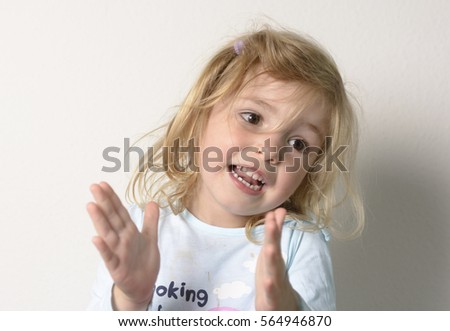 Cute little girl on a white background close-up