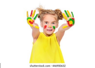 Cute little girl with painted colorful hands. Happy childhood. Isolated over white.