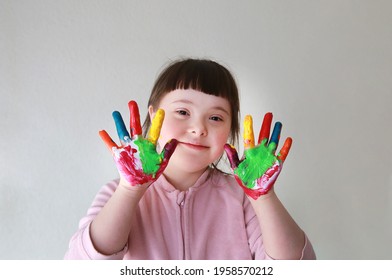 Cute little girl with painted hands.  - Shutterstock ID 1958570212