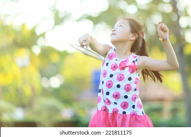 Cute little girl playing badminton