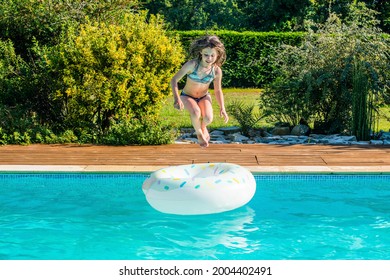 cute little girl playing in the pool - Powered by Shutterstock