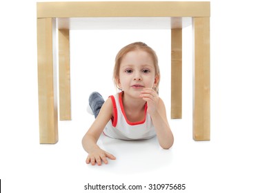 Cute Little Girl Playing Under The Table