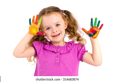 Cute little girl playing with watercolors