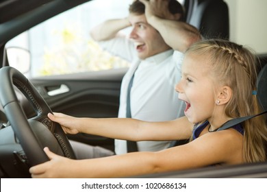 Cute Little Girl Pretending To Be Driving A Car With Her Father Both Looking Scared Screaming Danger Dangerous Insurance Safety Accident Prevention Children Kids Experience License Family Horrified