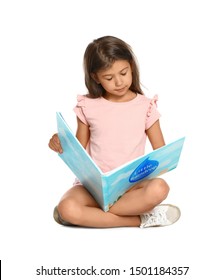 Cute little girl reading book on white background