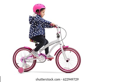 Cute Little Girl Riding A Bike Isolated On White Background