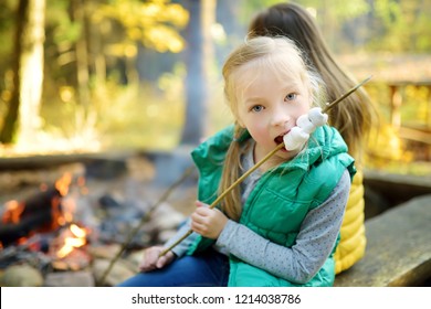 cute-little-girl-roasting-marshmallows-260nw-1214038786.jpg