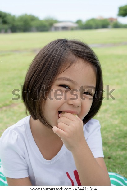 Cute Little Girl Short Hair Biting People Stock Image