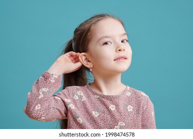 Cute Little Girl Showing New Earrings On Ear