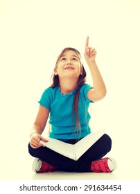 Cute Little Girl Sitting Cross Legged And Learning