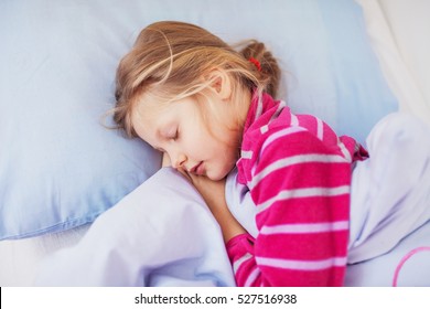 Cute Little Girl Sleeping In Bed