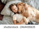 Cute Little Girl Sleeping With Dog In Embrace In Bed