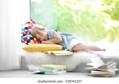 Cute Little Girl Sleeping On Windowsill