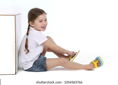 little girl wearing flip flops