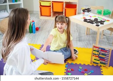 Cute little girl at speech therapist office - Shutterstock ID 1558727144