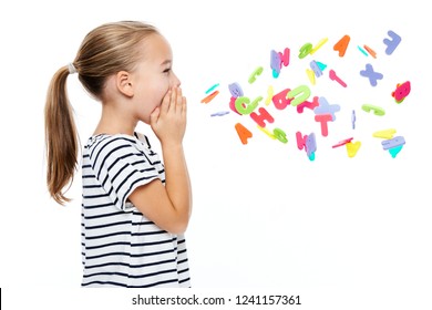 Cute Little Girl In Stripped T-shirt Shouting Out Alphabet Letters. Speech Therapy Concept Over White Background.