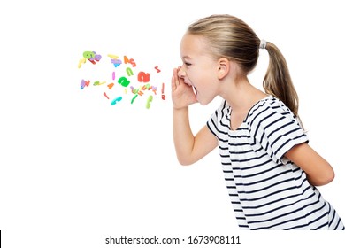 Cute Little Girl In Stripped T-shirt Shouting Out Alphabet Letters. Speech Therapy Concept Over White Background.