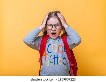 Cute Little Girl Suffering From Headache. Kid With Hands On Head. Stressed And Nervous Child Has Anxiety Problem. Back To School. Pupil In Glasses. Cool School.