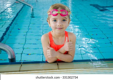 Cute Little Girl In Swimming Pool