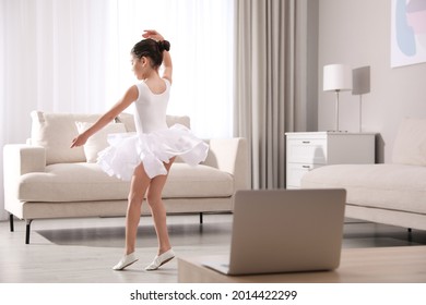 Cute Little Girl Taking Online Dance Class At Home