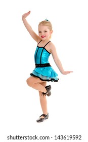 Cute Little Girl Tap Dancer Poses with Leg  Lifted in Tap Shoes and Costume