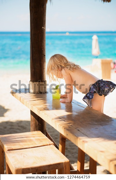 Naked girls and preteens Cute Little Girl Topless Swimsuit Drinking Stock Photo Edit Now 1274464759