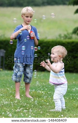 Similar – junge wirft einen Ball auf die Oma