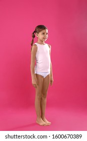 Cute Little Girl In Underwear On Pink Background