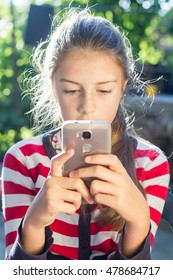 Cute Little Girl Using The Phone