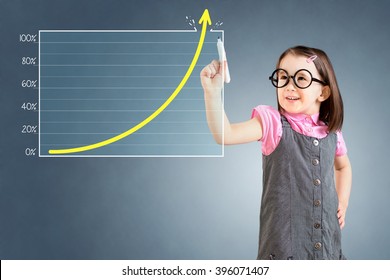 Cute little girl wearing business dress and drawing over target achievement graph. Blue background. - Powered by Shutterstock