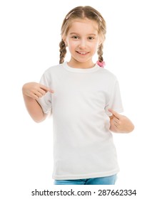 cute little girl in a white T-shirt and blue jeans on a white background