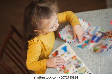 Cute little girl writes a letter to Santa Claus. Christmas concept - Shutterstock ID 2072780924