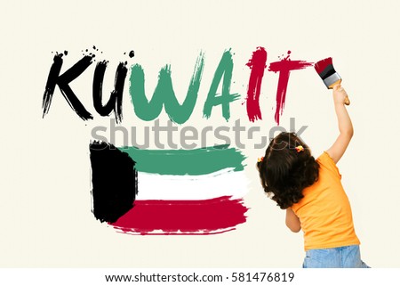 Cute little girl writing KUWAIT and drwaing Kuwait Flag using painting brush on wall background