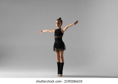 Cute Little Gymnast In Stage Clothes On White Background