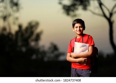 Cute Little Indian Asian School Boy With Note Book And Bag