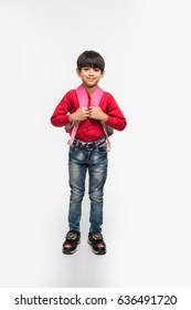 Cute Little Indian/asian Boy Child With School Bag, Standing Isolated Over White Background