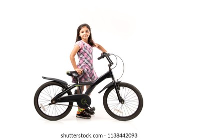 Cute Little Indian/asian Girl Riding On Bicycle, Isolated Over White Background 