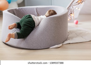 Cute Little Infant Playing With Colorful Balls In Soft Playmat Ball Pit, Dry Pool. Little Cute Baby Having Fun In Ball Pit On Birthday Party At Home.