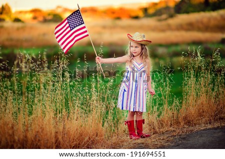 cute little kid celebrate independence day 4th july with an american flag