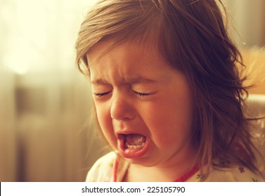 	cute little kid is crying