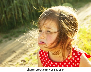 Cute Little Kid Is Crying Outdoors