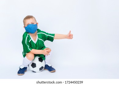 Cute Little Kid With Mask Play Soccer Over White Background. Kid Activities.Training Game Concept.