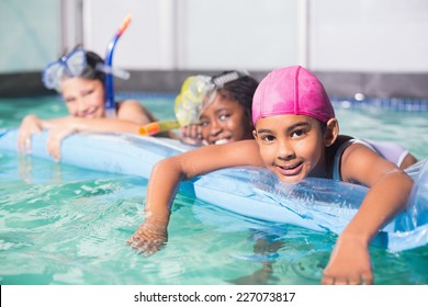 Cute little kids swimming in the pool at the leisure center - Shutterstock ID 227073817
