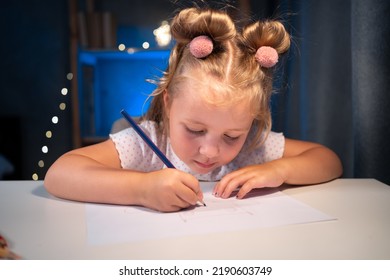 Cute Little Preschooler Child Girl Drawing At Home At Night. Copy Space