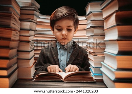 Similar – boy reading books