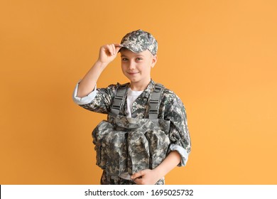 Cute Little Soldier On Color Background