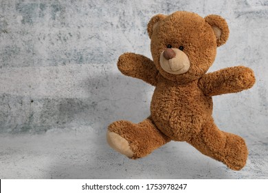 Cute Little teddy bear have fun jumping on white background with copy space