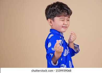 Cute Little Vietnamese Boy In Ao Dai Dress Smiling. Tet Holiday