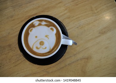 Cute Lovely Bear Smile Face Hot Latte Art Coffee Cup On The Wood Table In The Cafe 