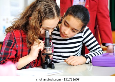 Cute Lovely School Children At Classroom Having Education Activities